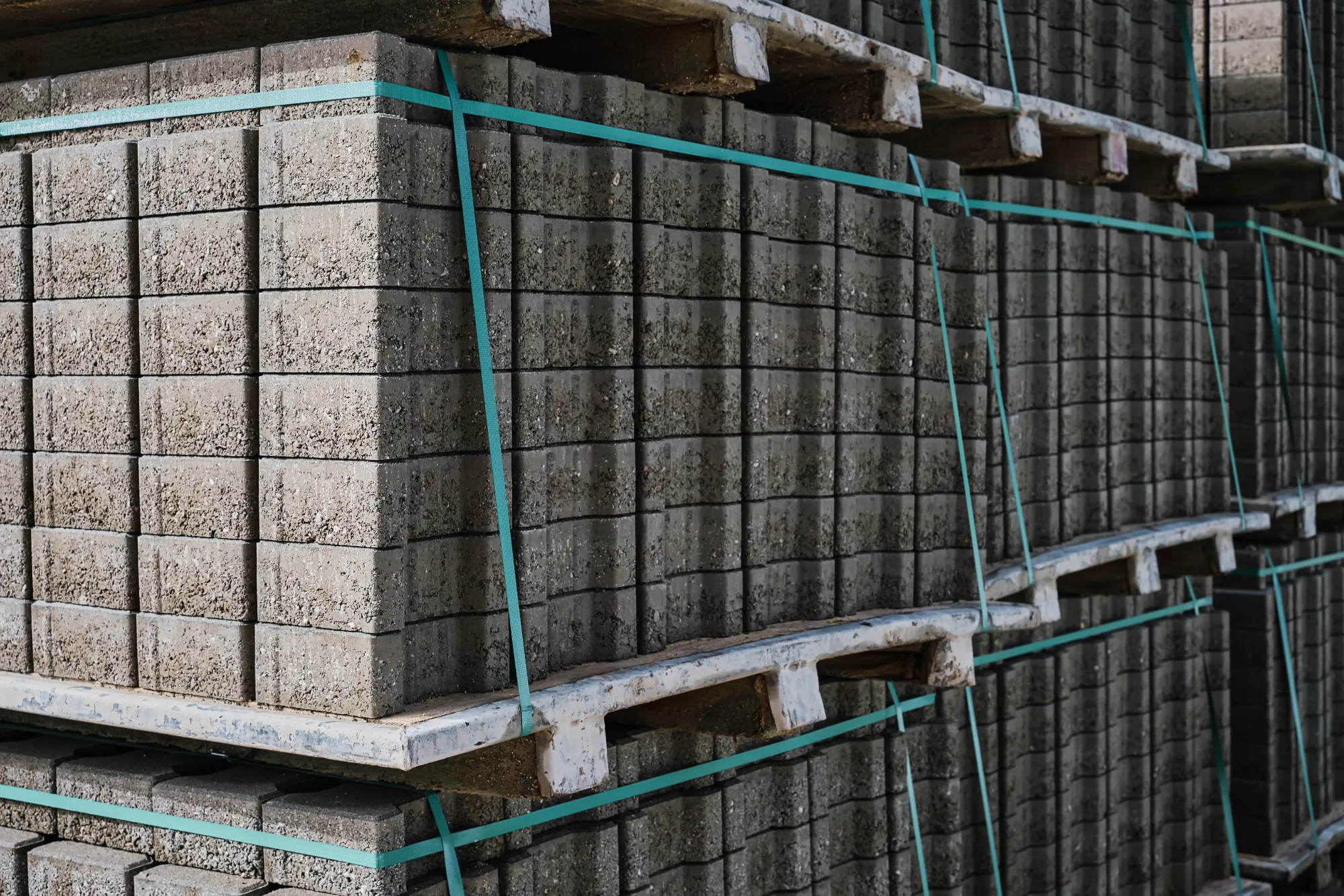 Stacked blocks on pallets secured with strapping bands